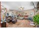Open-concept living room with comfortable seating, ceiling fan, and decorative accents at 1245 Elm Grove Ln, Greenwood, IN 46143