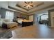 Large main bedroom with tray ceiling, wood floors, sitting area, and ample natural light at 1245 Elm Grove Ln, Greenwood, IN 46143