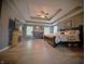 Spacious main bedroom with tray ceiling, wood floors, fireplace, and large windows at 1245 Elm Grove Ln, Greenwood, IN 46143