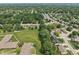 Spacious neighborhood view from above, with well-spaced houses and green surroundings at 1311 Old Hickory Dr, Greenwood, IN 46142