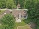 Aerial view of a well-maintained home with a charming backyard and mature trees, creating a private oasis at 1311 Old Hickory Dr, Greenwood, IN 46142