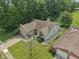 Expansive aerial view of the home showcasing its well-manicured lawn and mature trees at 1311 Old Hickory Dr, Greenwood, IN 46142