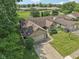 An aerial view of a home showing its brick exterior and a well manicured front yard at 1311 Old Hickory Dr, Greenwood, IN 46142