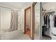 This bathroom features a shower with tan curtains at 1311 Old Hickory Dr, Greenwood, IN 46142