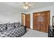 This bedroom features a ceiling fan, closet, daybed, and neutral carpeting at 1311 Old Hickory Dr, Greenwood, IN 46142