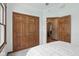 Bedroom featuring neutral carpet, wood trim, and large closet at 1311 Old Hickory Dr, Greenwood, IN 46142