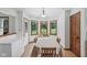 Cozy dining room with hardwood floors, ample natural light, and adjacent outdoor access at 1311 Old Hickory Dr, Greenwood, IN 46142