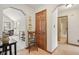 Hallway featuring detailed archways, chair rail, and views to bathroom, living room, and front entry at 1311 Old Hickory Dr, Greenwood, IN 46142