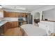 Eat-in kitchen features wood cabinets, stainless appliances, laminate countertops, and open layout to living space at 1311 Old Hickory Dr, Greenwood, IN 46142