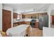 Eat-in kitchen features wood cabinets, stainless appliances, laminate countertops, and dining table at 1311 Old Hickory Dr, Greenwood, IN 46142
