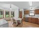 Eat-in kitchen features wood cabinets, stainless dishwasher, laminate countertops, and breakfast nook by windows at 1311 Old Hickory Dr, Greenwood, IN 46142
