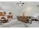Bright living room flows into the kitchen, with a fireplace and comfortable seating area at 1311 Old Hickory Dr, Greenwood, IN 46142
