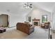 Bright living room with a vaulted ceiling, a fireplace, and comfortable seating furniture at 1311 Old Hickory Dr, Greenwood, IN 46142