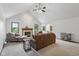 Spacious living room featuring a fireplace, vaulted ceilings, and comfortable seating at 1311 Old Hickory Dr, Greenwood, IN 46142