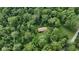 Aerial view of home surrounded by dense lush forest, highlighting the property's privacy and natural setting at 1350 Inverness Farms Rd, Martinsville, IN 46151