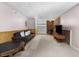 Finished basement with wood burning stove, neutral carpet, and wood paneling offers a cozy living space at 1350 Inverness Farms Rd, Martinsville, IN 46151