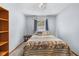Simple bedroom with a comfy bed, window with curtains, and a bookcase, creating a relaxing retreat at 1350 Inverness Farms Rd, Martinsville, IN 46151