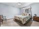Cozy bedroom with a floral comforter, natural light, and a chair for relaxing at 1350 Inverness Farms Rd, Martinsville, IN 46151