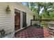 Back deck with outdoor rug, furniture, and access to the house through a sliding glass door at 1350 Inverness Farms Rd, Martinsville, IN 46151