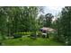 Scenic front yard with mature trees, expansive lawn, and wooded surroundings at 1350 Inverness Farms Rd, Martinsville, IN 46151