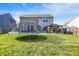 A large trampoline and cozy gazebo highlight this home's well-maintained backyard and green lawn at 1375 Crabapple Rd, Franklin, IN 46131