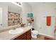 Functional bathroom with a sink, mirror, toilet, and owl-themed shower curtain at 1375 Crabapple Rd, Franklin, IN 46131