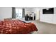 This bedroom features a large window, modern ceiling fan, and neutral carpeting at 1375 Crabapple Rd, Franklin, IN 46131