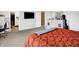 This large bedroom has a modern TV, plush carpeting, and neutral walls at 1375 Crabapple Rd, Franklin, IN 46131