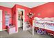 Vibrant bedroom with creative storage, colorful decor, and soft carpet at 1375 Crabapple Rd, Franklin, IN 46131