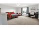 Bright and airy main bedroom with a large window, ceiling fan, and neutral carpeting at 1375 Crabapple Rd, Franklin, IN 46131
