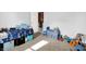 Bright bedroom features a dinosaur theme, a cozy bed, and a convenient toy storage box at 1375 Crabapple Rd, Franklin, IN 46131