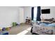 Bright bedroom with a TV, window with natural light, and toy storage at 1375 Crabapple Rd, Franklin, IN 46131