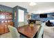 Open dining area with traditional wood furnishings, access to living room, and decorative wall art at 1375 Crabapple Rd, Franklin, IN 46131