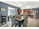 Cozy dining area with views into an open kitchen and a connected gathering room at 1375 Crabapple Rd, Franklin, IN 46131