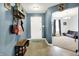 Inviting entryway with coat rack, shoe storage, and view into the living room at 1375 Crabapple Rd, Franklin, IN 46131