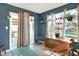 Bright sunroom with plants, natural light, tiled flooring, and access to the backyard through sliding doors at 1375 Crabapple Rd, Franklin, IN 46131