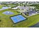 Amazing overhead shot of the community featuring tennis courts, clubhouse, and pond with fountain at 15937 Marsala Dr, Fishers, IN 46037