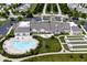 Wonderful aerial view of the community clubhouse, pool, bocce ball courts, and manicured landscaping at 15937 Marsala Dr, Fishers, IN 46037