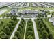 Expansive aerial view of the neighborhood, featuring a clubhouse, tennis court, and pond at 15937 Marsala Dr, Fishers, IN 46037