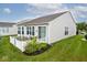 Well-maintained backyard featuring a patio, white fence and manicured lawn and landscaping at 15937 Marsala Dr, Fishers, IN 46037