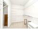 Walk-in closet with lots of shelving, bright light, and neutral carpet at 15937 Marsala Dr, Fishers, IN 46037