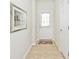 Neutral hallway features tile flooring, an exterior door with window, and an interior door at 15937 Marsala Dr, Fishers, IN 46037