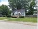 Charming home with a well-manicured lawn, inviting front porch and beautiful landscaping at 1637 Meridian St, Columbus, IN 47201