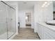 Bright bathroom features double sink vanity, framed glass shower and views to the main bedroom at 16465 Mount Logan Rd, Noblesville, IN 46060