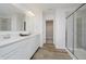 Bright bathroom features double sink vanity, framed mirror and glass shower, with walk-in closet at 16465 Mount Logan Rd, Noblesville, IN 46060