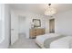 Bright primary bedroom with neutral carpet, stylish pendant lighting and walk in closet at 16465 Mount Logan Rd, Noblesville, IN 46060