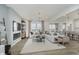 Spacious living room featuring neutral tones, fireplace, and bright natural light at 16465 Mount Logan Rd, Noblesville, IN 46060