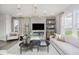 Bright living room with modern decor, lots of seating and a fireplace at 16465 Mount Logan Rd, Noblesville, IN 46060