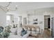 Open concept design showcasing the living room and kitchen with white cabinets at 16465 Mount Logan Rd, Noblesville, IN 46060