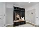 Mudroom area with a bench and coat rack for storage, connecting the garage to the house at 16465 Mount Logan Rd, Noblesville, IN 46060